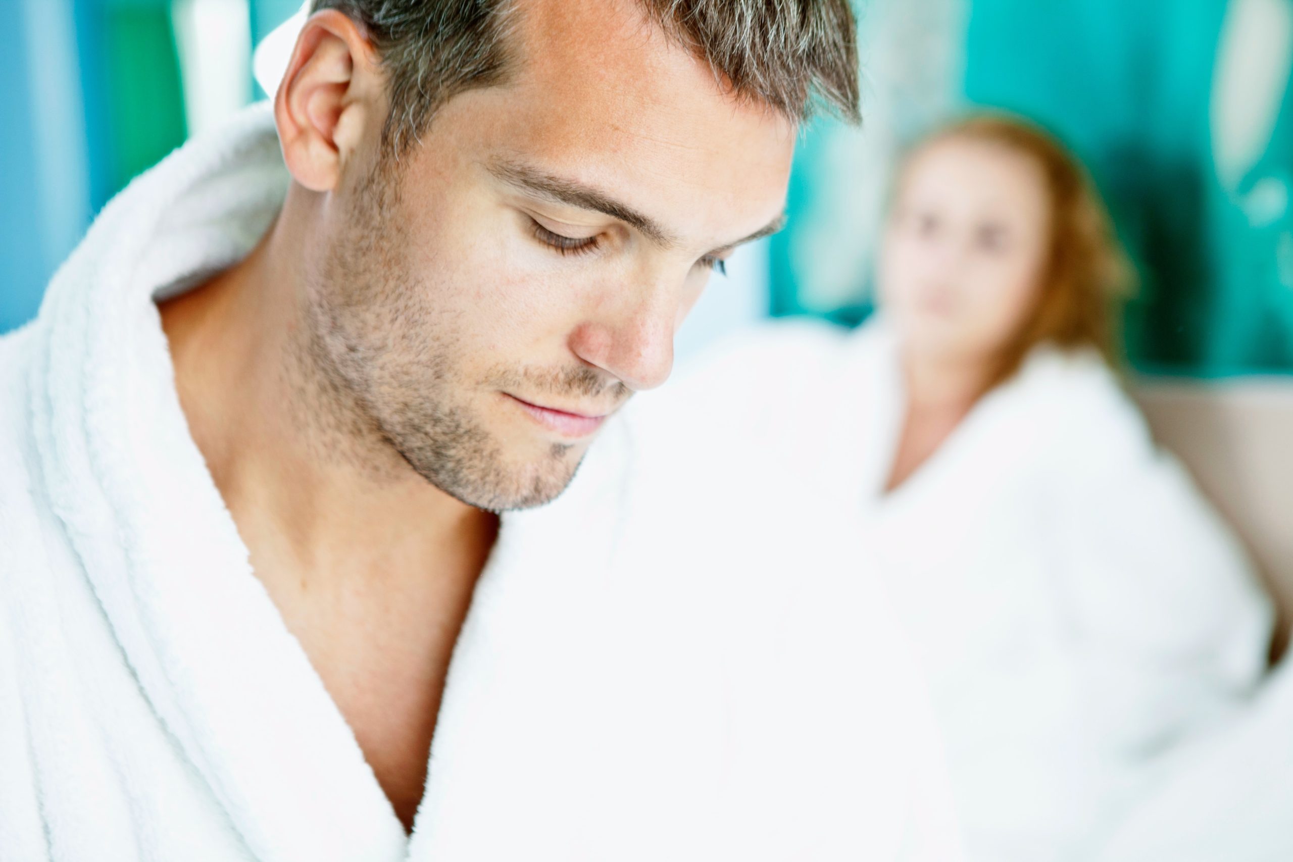 A man in white shirt and woman in blue dress