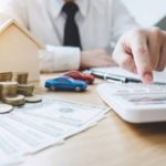 Calculating finances with money and calculator.