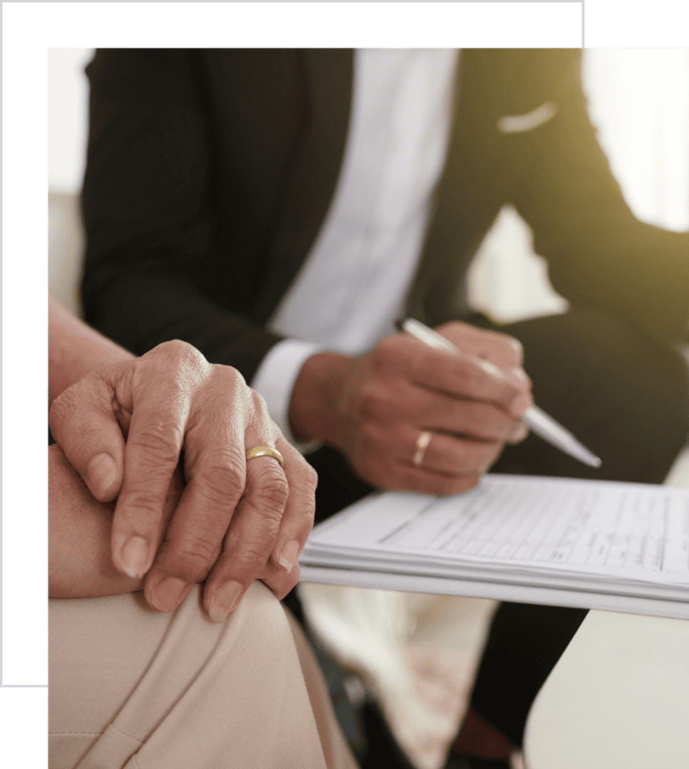 Meeting with documents and hands, writing notes.