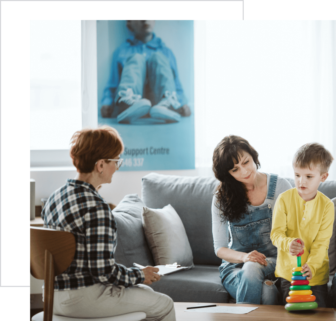 Child playing with toy during therapy session.