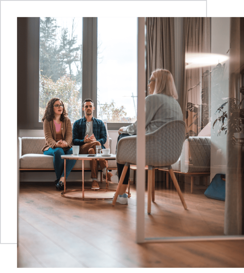 Couple in therapy session with counselor.