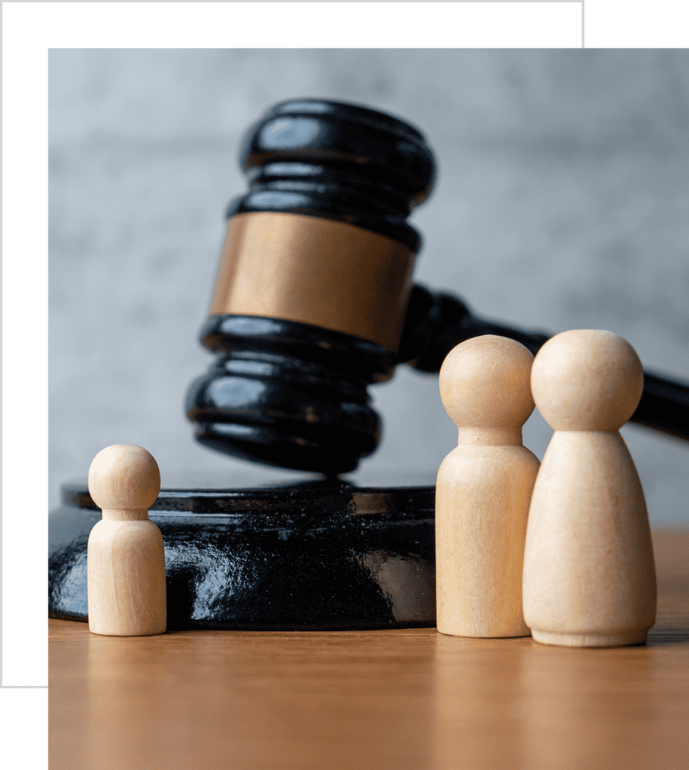 Judge's gavel with wooden family figures.