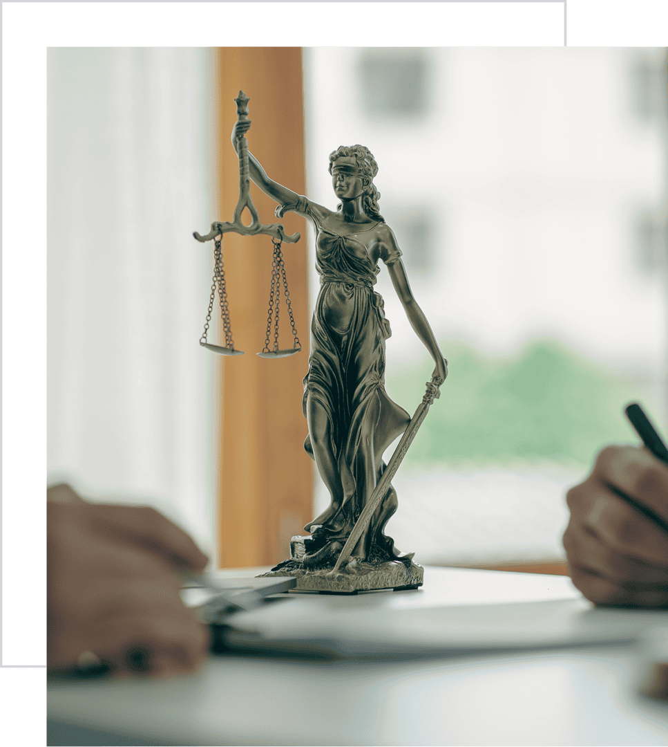 Lady Justice statue on office desk.