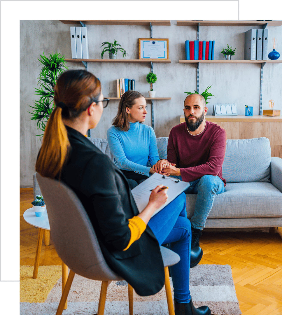 Couple in therapy session with counselor.