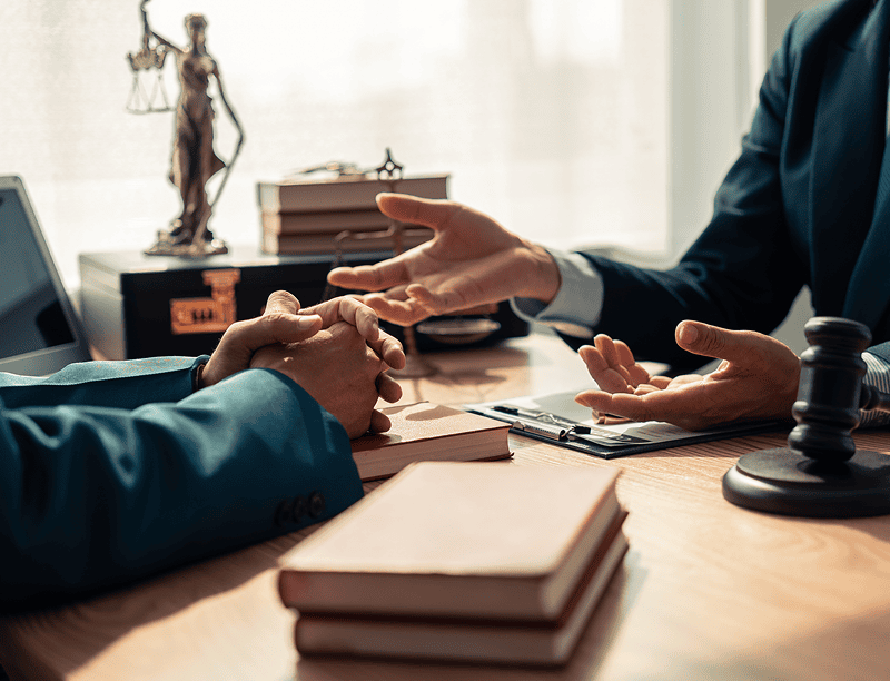 Two people discussing at a lawyer's office.